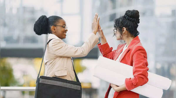 Confident people celebrating another's success without envy